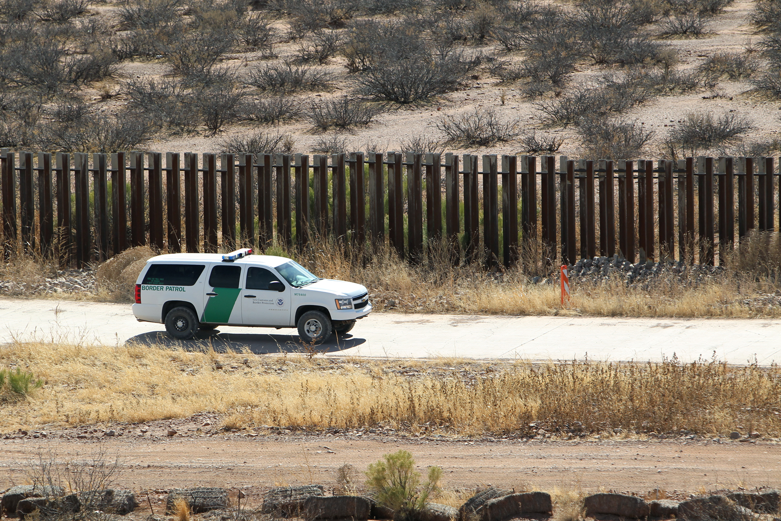 U.S. Border Patrol agents on watch at the border fence line in Arizona