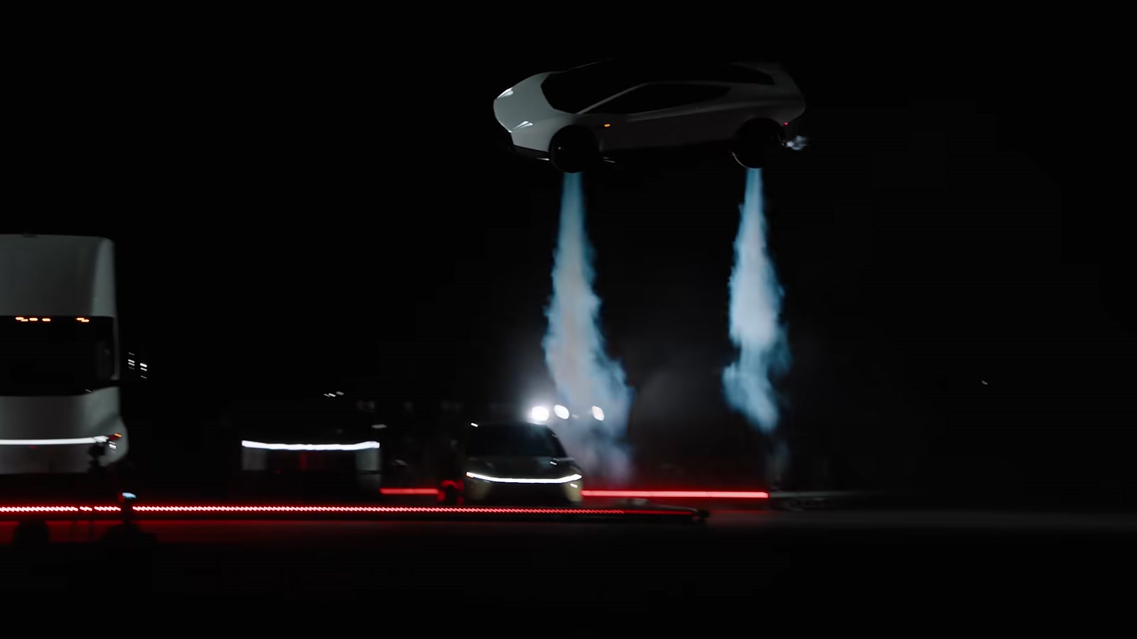 The Tesla Roadster airborne over a Tesla Semi and Cybercab, two cold-gas thruster plumes firing beneath it.